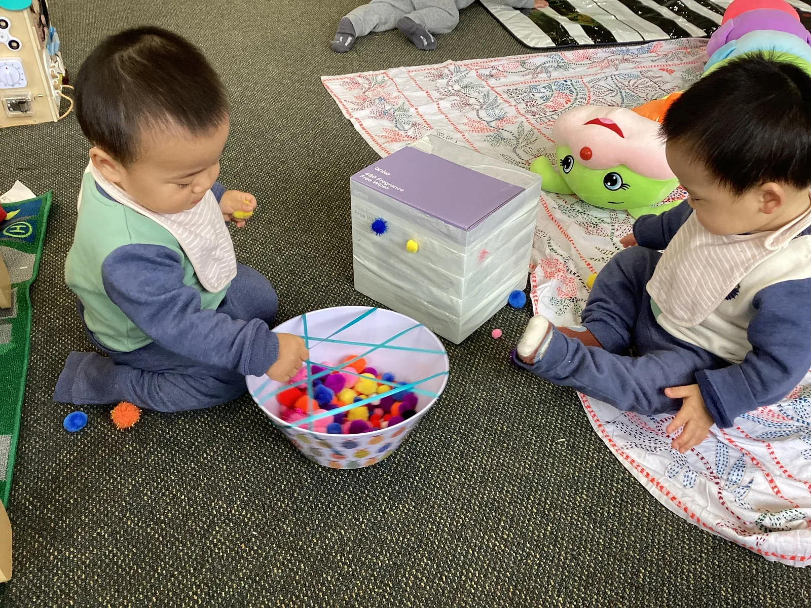 Fine motor play with pom-poms