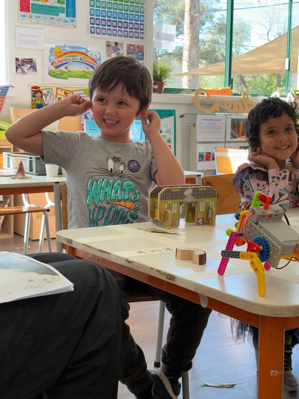Children exploring a robotics building activity together