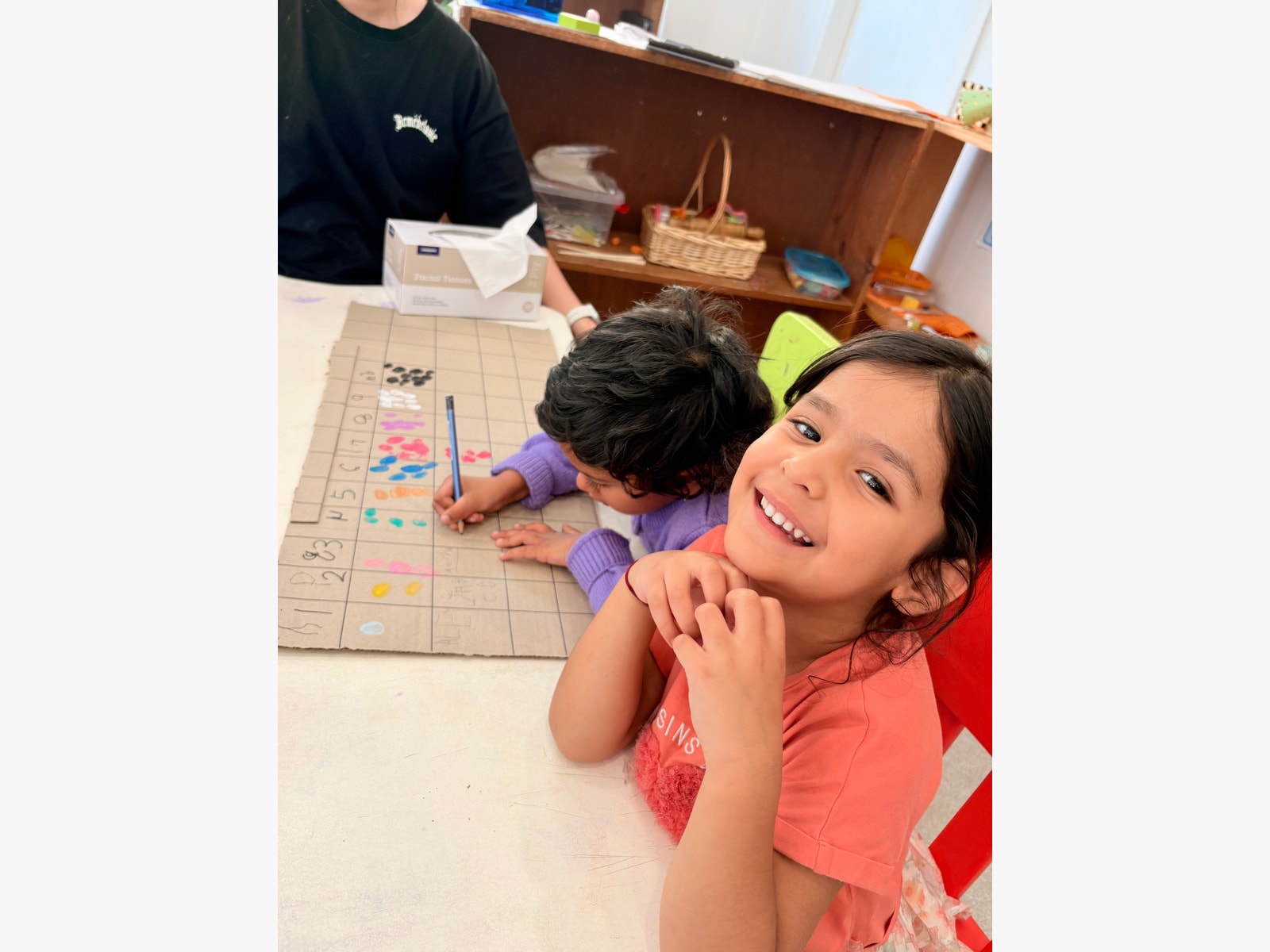 Recording data together on our handmade counting chart