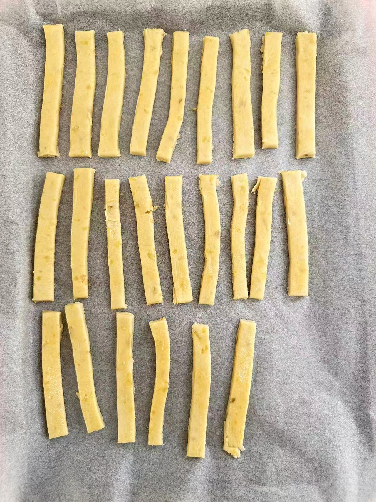 Hand-cut sweet potato cracker sticks before baking