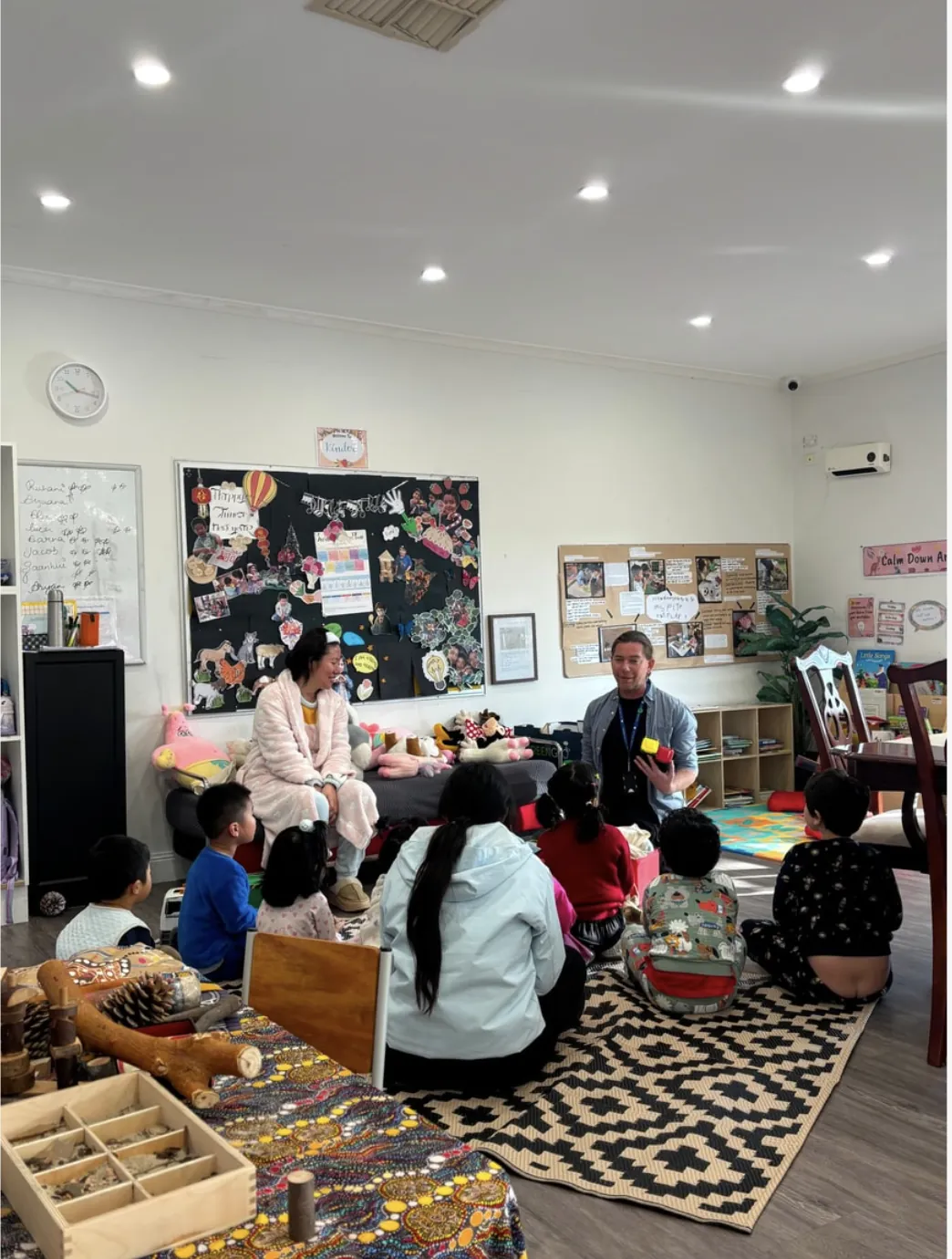 Educators and children gathered for group time in the Little Sharkies kinder room