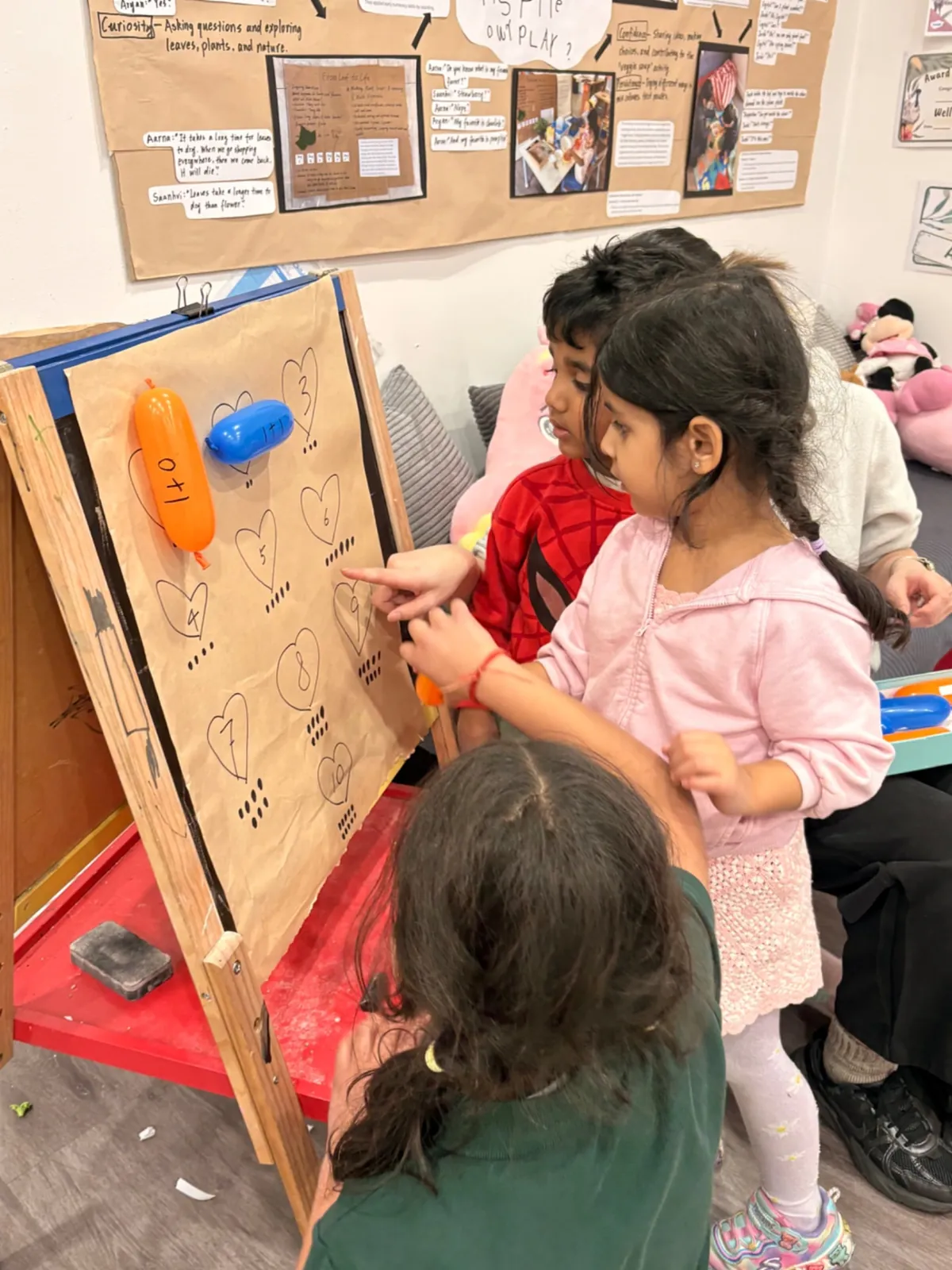 Exploring number bonds with balloons at the easel
