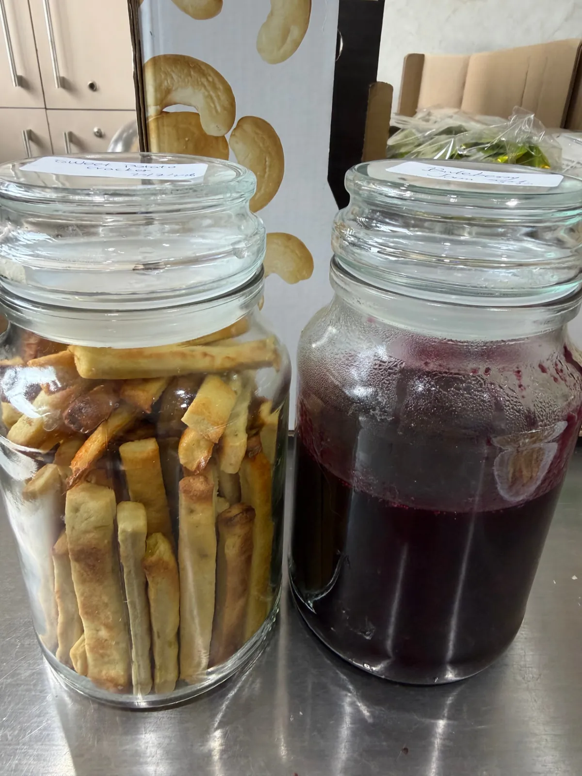 Homemade sweet potato crackers and blueberry jam in jars